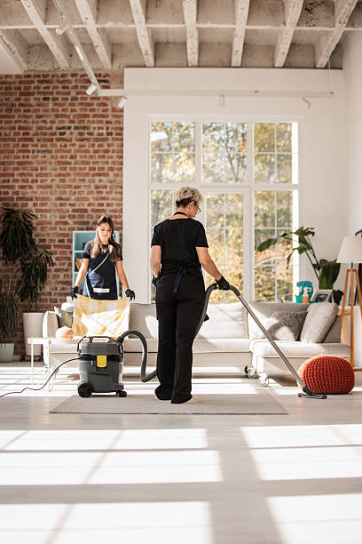 istock Cleaning Crew Tidying Large Apartment Interior 2214251941
