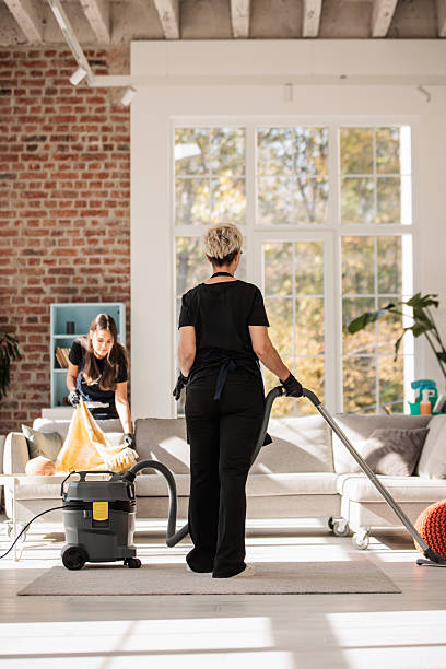 istock Cleaning Crew Tidying Large Apartment Interior 2214251960