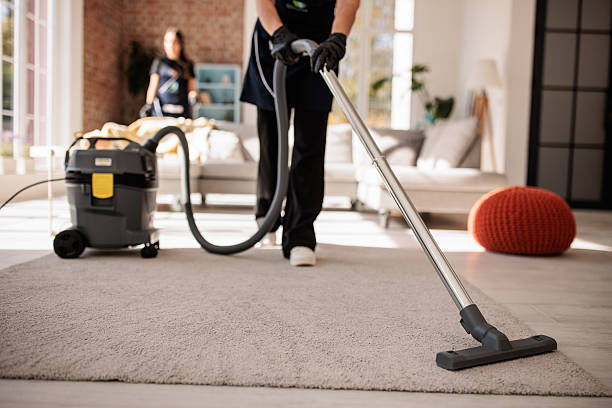istock Cleaning Crew Tidying Large Apartment Interior 2214252235