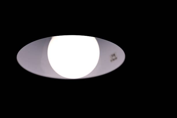 istock Burning table lamp, abstraction in the form of a human eye 2214253172