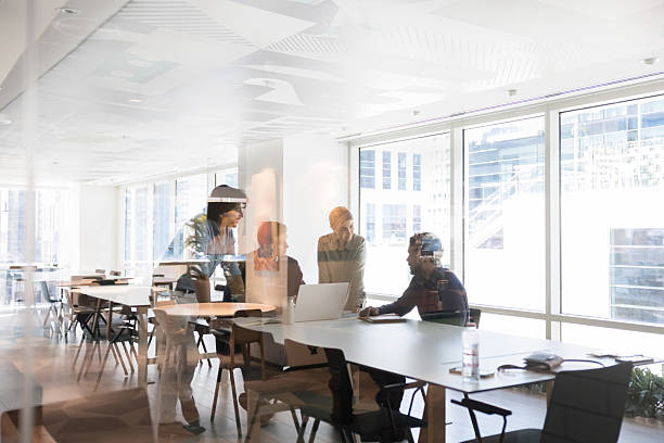 istock Diverse business group meeting in open office, co-working space 2214253297