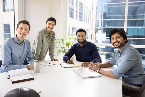 istock Happy multiethnic business colleagues posing for portrait 2214254073