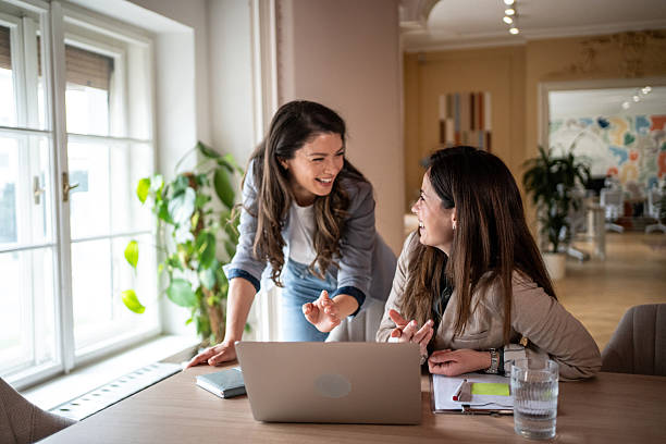 istock Two businesswomen collaborating on a project using laptop in the office 2214256029