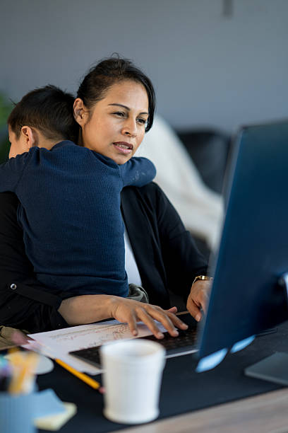 istock Mother Balancing Work From Home While Caring for Her Child 2214258034