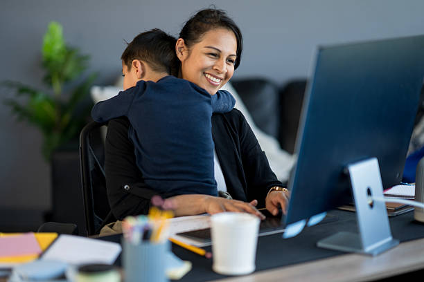 istock Mother Balancing Work From Home While Caring for Her Child 2214258039