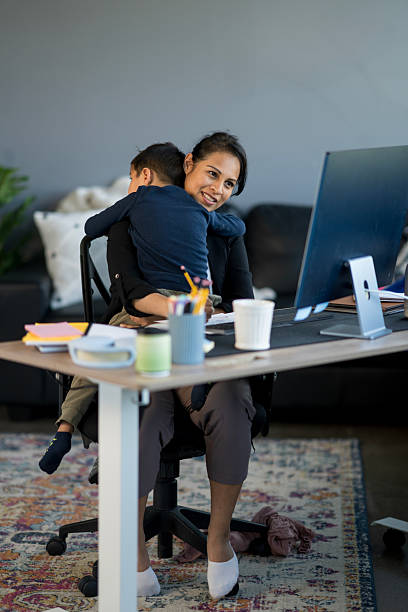 istock Mother Balancing Work From Home While Caring for Her Child 2214258047