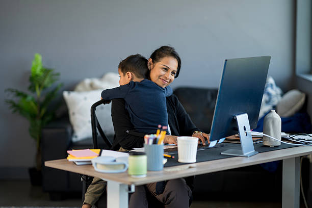 istock Mother Balancing Work From Home While Caring for Her Child 2214258051