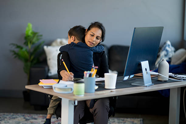 istock Mother Balancing Work From Home While Caring for Her Child 2214258057