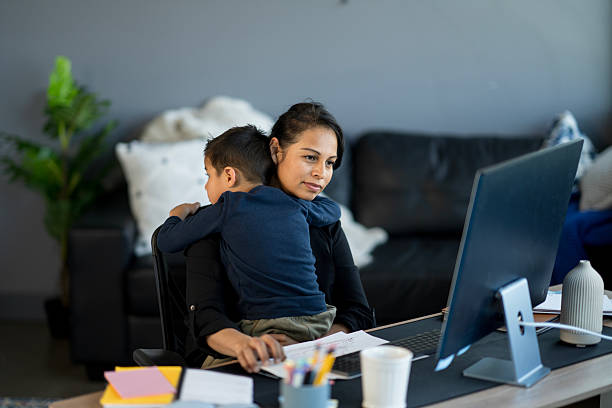 istock Mother Balancing Work From Home While Caring for Her Child 2214258071