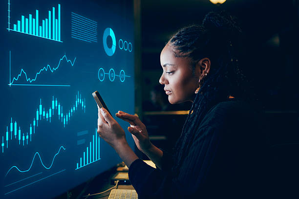 istock Focused Businesswoman Analyzing Data on Smartphone 2214259305