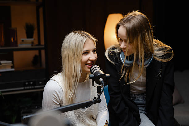 istock Two young women recording a podcast in a home studio 2214262213