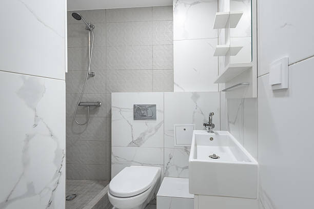 istock Modern Bathroom Interior With Marble Tiles and Compact Functional Fixtures 2214262622