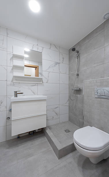 istock Modern Bathroom with White Tiles and Contemporary Finishes 2214262780