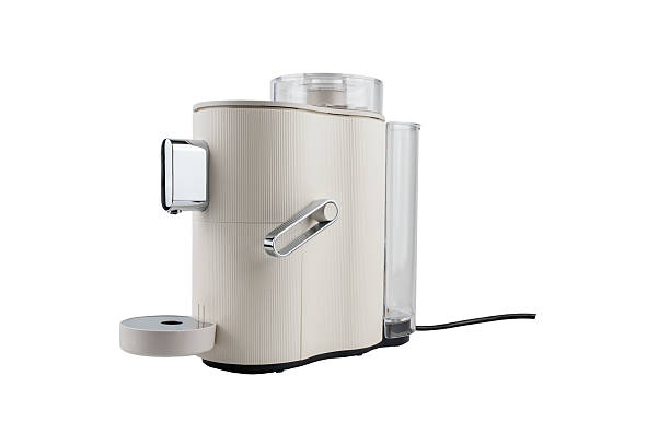 istock Angled side view of a sleek countertop coffee machine with chrome elements and transparent water tank. 2214262893