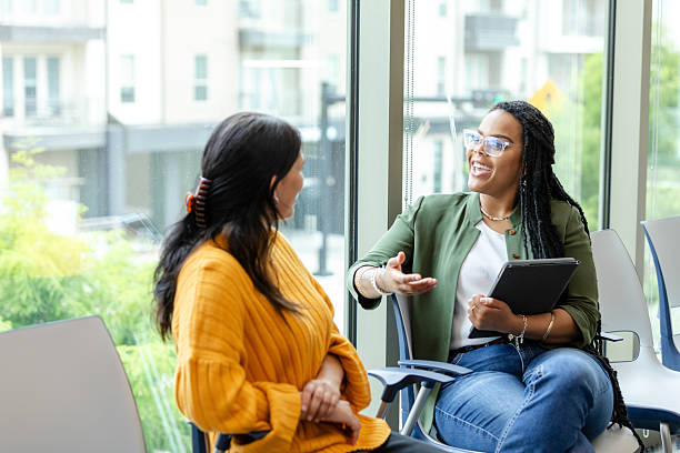 istock Two Women Talking During a Counseling Session 2214263374