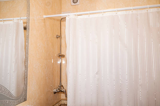 istock Bathroom with white shower curtain. A shower curtain 2214268510