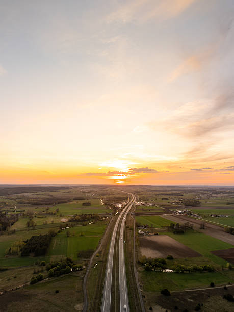 istock Sunset Panorama of Speeding Motorway 2214272394