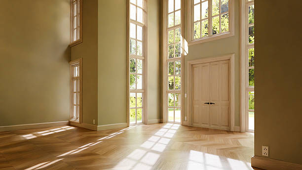 istock Sunlight illuminating empty room with parquet and tall windows 2214272567
