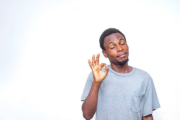 istock Confident Individual Making a Gesture Symbolizing Approval or Excellence 2214274859