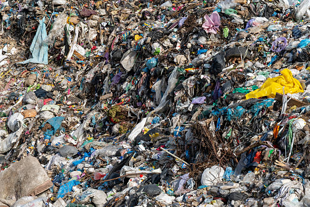 istock Overstuffed landfill disposal area brimming with various waste materials, revealing overconsumption, and global pollution problem 2214279947