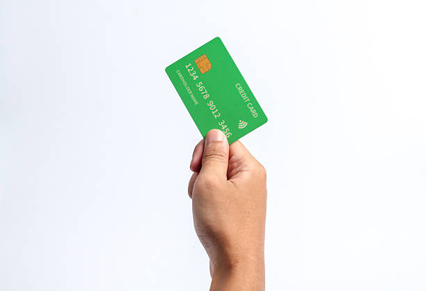 istock hand holding credit card on white background.business concept 2214280699