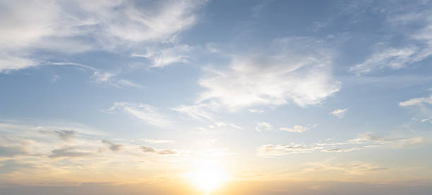 istock Front view and full frame of beautiful morning or evening blue and orange sky with cloudy while sunsets or sunrises taken at the sea used as natural blackground texture 2214284355