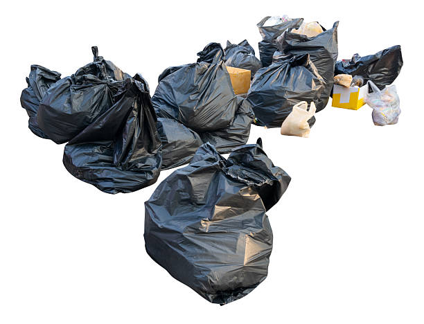 istock Large group of waste in black plastic bag at garbage dump isolated on white background with clipping path 2214284359