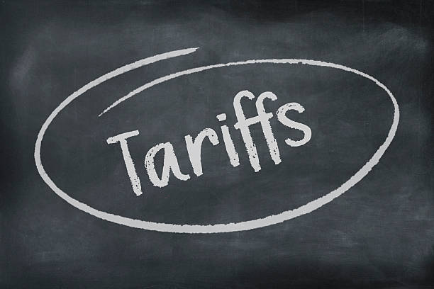 istock The word tariffs written and circled on a blackboard background. 2214286868