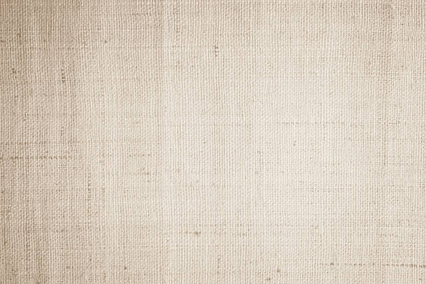 istock Brown sackcloth woven texture background in natural pattern. Jute hessian burlap, linen background in light beige cream color blank. Weaving canvas fiber line cotton cloth textured as organic. 2214287172