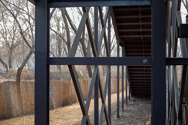 an iron structure that supports the wooden stairs.