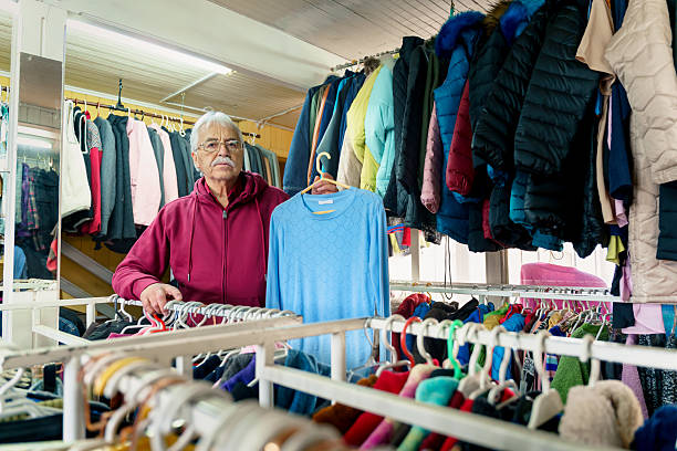 istock Senior man managing his small second hand clothes business at home 2214297904
