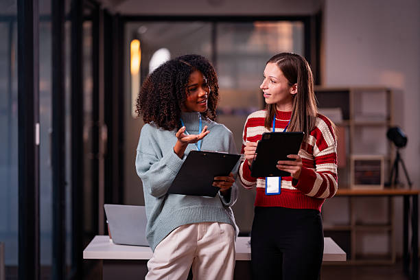 istock Two women with teamwork Laptop and research for articles, collaborations, and schedule evening, after-hours meetings. 2214298074