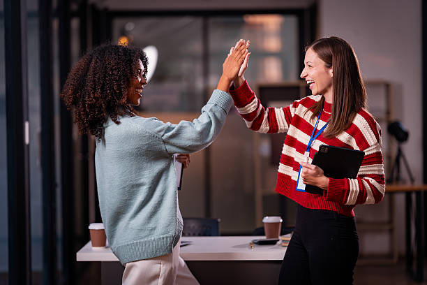 istock Two women's hands shaking hands symbolizes effective negotiation, making an agreement, greeting business partners or mutual respect in the workplace. 2214298083