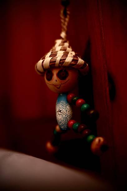 A vintage Asian wooden toy. Moody lighting.