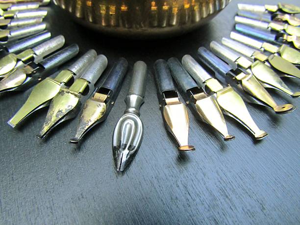 Vintage calligraphy fountain pen nibs with different nibs designed for different purposes at black background