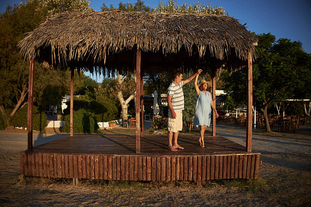 istock Senior couple dancing on a sunrise 2214315067