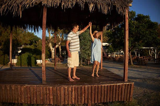 istock Senior couple dancing on a sunrise 2214315241