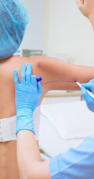 istock asian woman arm fat examined 2214315817