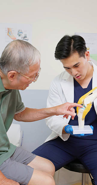istock asian elderly knee health consult 2214316325