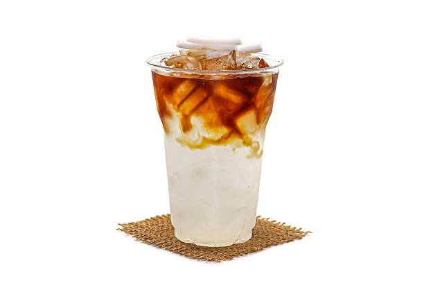 istock Ice Americano coffee mix coconut milk sliced served on sack in white background. 2214316706