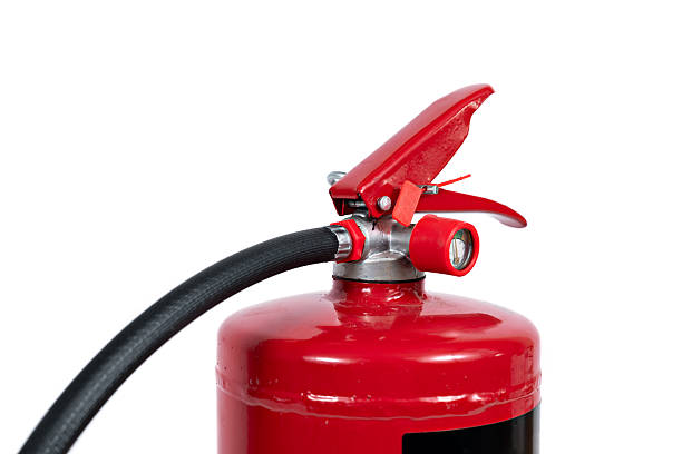 istock A red fire extinguisher with black hose on white background 2214319208
