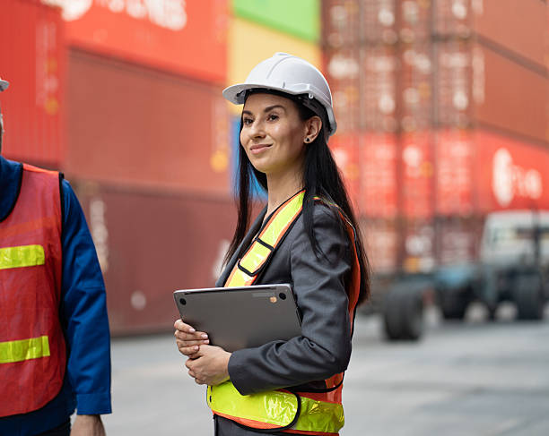 istock Caucasian woman supervisor engineer worker working with truck at container site 2214319848
