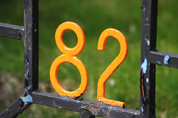 The number 82 on a fence