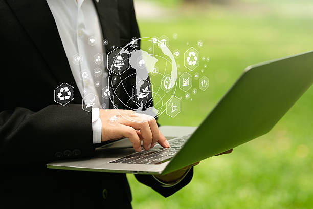 istock Businessman typing on computer doing field analysis with virtual icons about environment, analysis, investment, green business etc. 2214322703