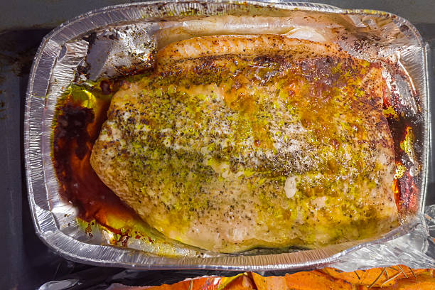 istock Baked salmon fillet in a foil baking dish 2214324361