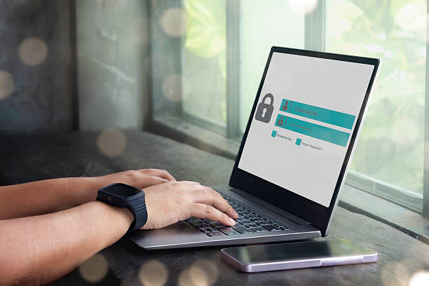 istock Business person working on laptop computer at home with warning window on screen. Blocking spam email, warning pop-up for phishing mail, network security concept. 2214327741