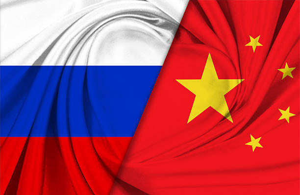 istock Russian and Chinese flags together. 2214329475