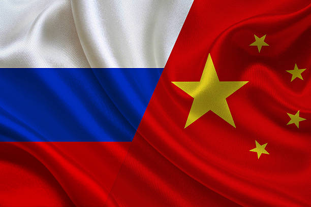 istock Russian and Chinese flags together. 2214329483