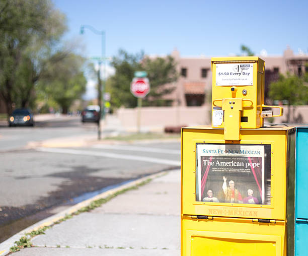 Santa Fe, NM: A Santa Fe New Mexican vending machine features a newspaper headline reading \