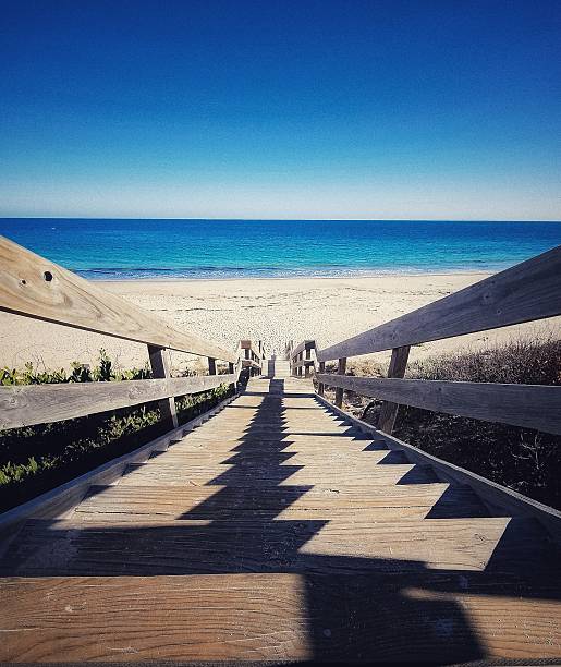 istock Stairs leading to beach 2214336262